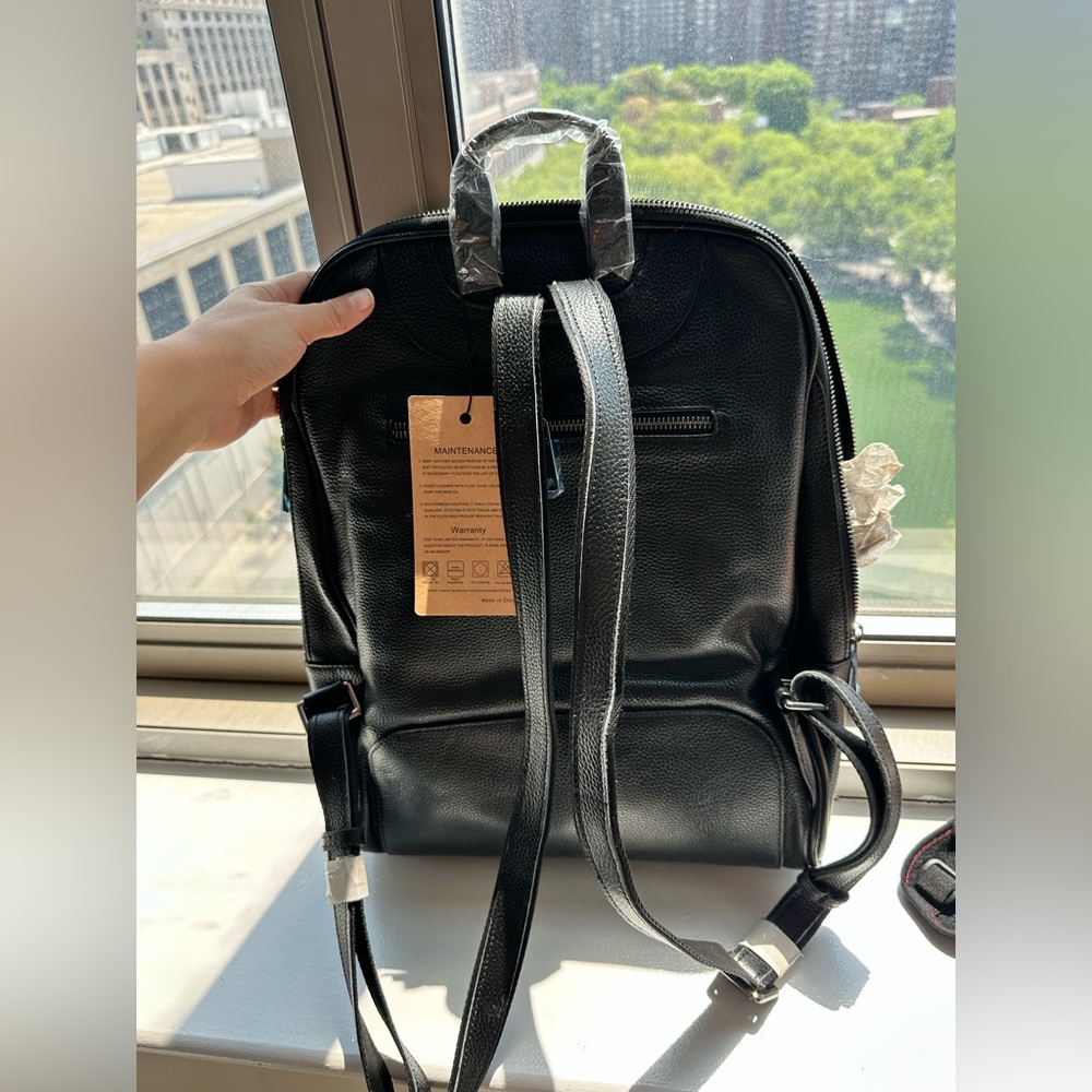 Brand new black leather backpack